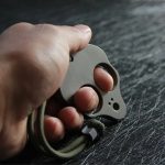 Portable Alien-Inspired Titanium Knuckle Duster for Self-Defense